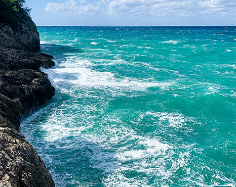 waves crashing against a rocky shoreline